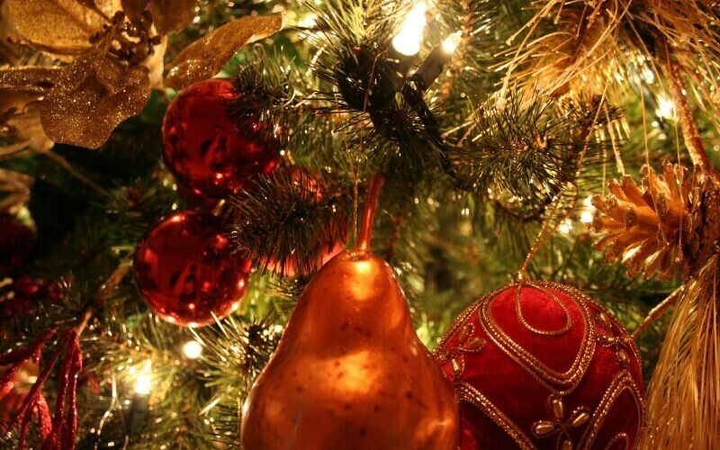 Christmas decors and lights hanging on a Christmas tree