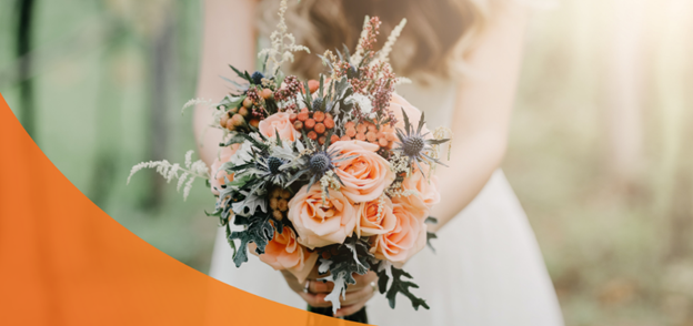 Bride holding a wedding bouquet with roses