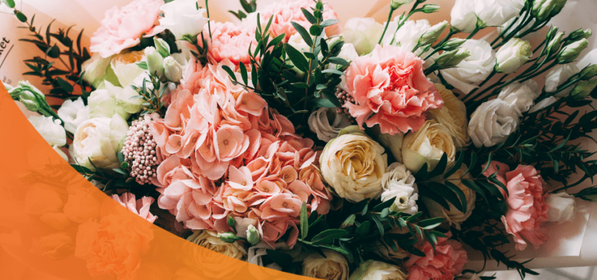 Roses, carnations, and other flowers arranged in a bouquet